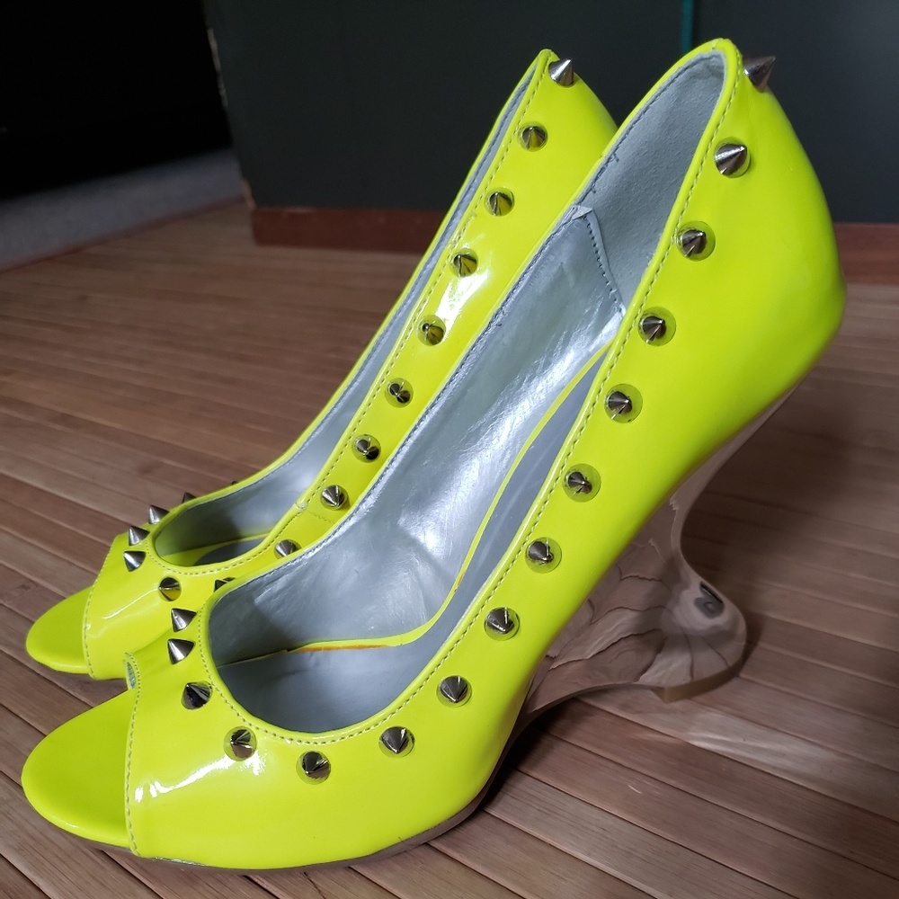 Neon yellow spiked heels